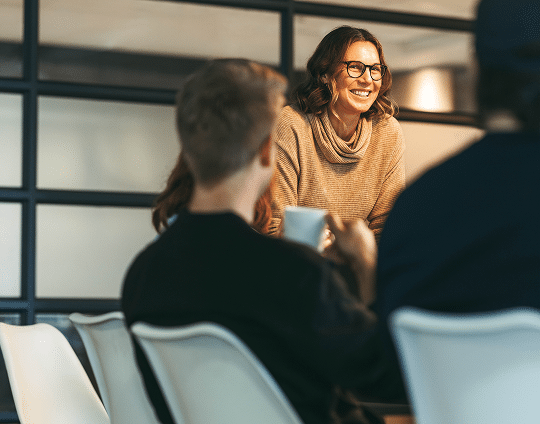 lady-smiling-in-front-of-audience Lady smiling in front of audience