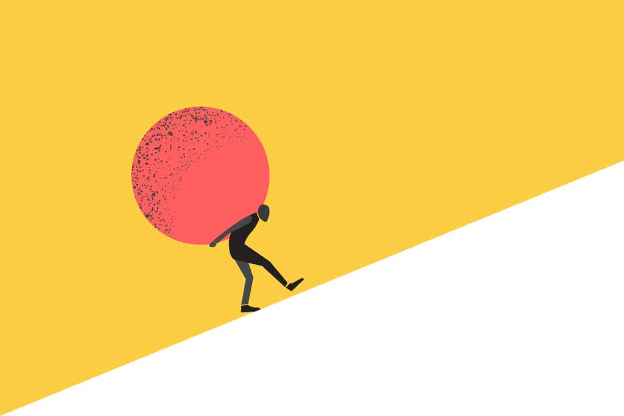 Businessman carrying a huge rock on his back, symbolizing stress, burden, or work pressure